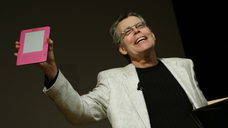 Stephen King with hot pink eReader.