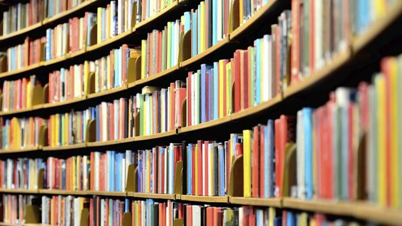 The featured image is a picture of a large bookshelf stuffed with books.