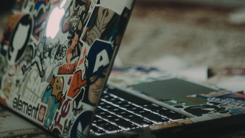 Close up of laptop with stickers.
