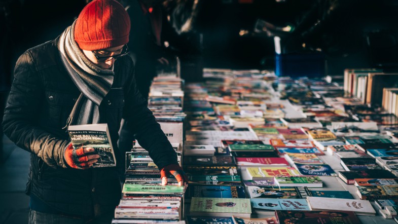 Guy Picking Books