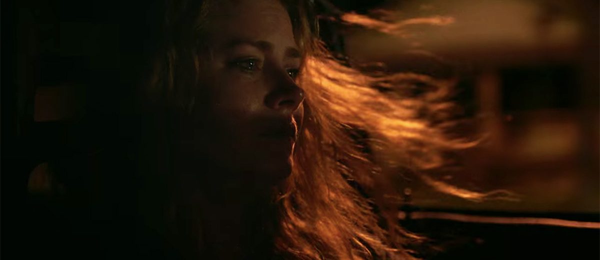 Amy Adams crying while driving.