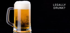 A full beer stein reading "legally drunk?"