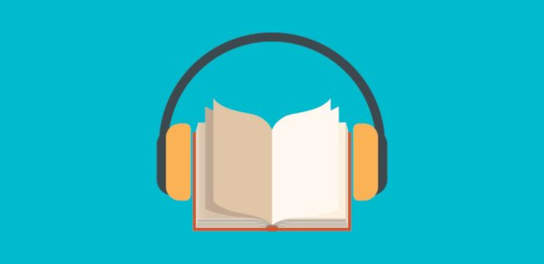 A book with headphones over the cover, representing an audiobook