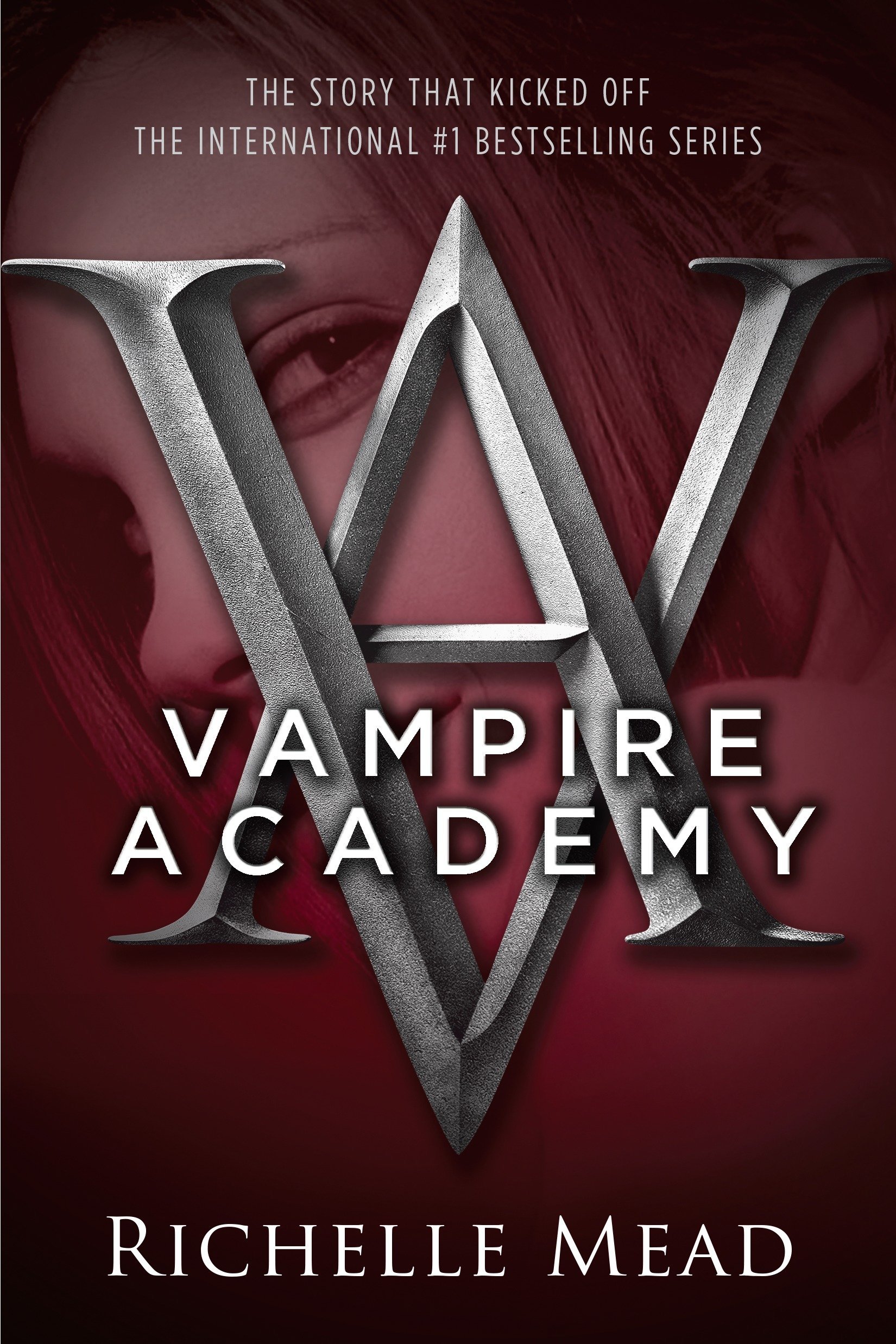 The cover to Vampire Academy, featuring the school logo against the looming visage of a young woman
