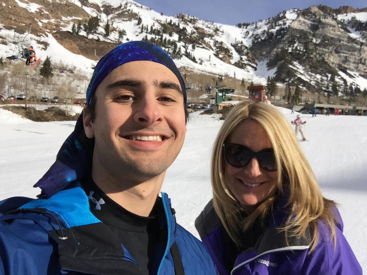 Jesse Galganov with his mother Alisa Clamen in front of snowy mountains
