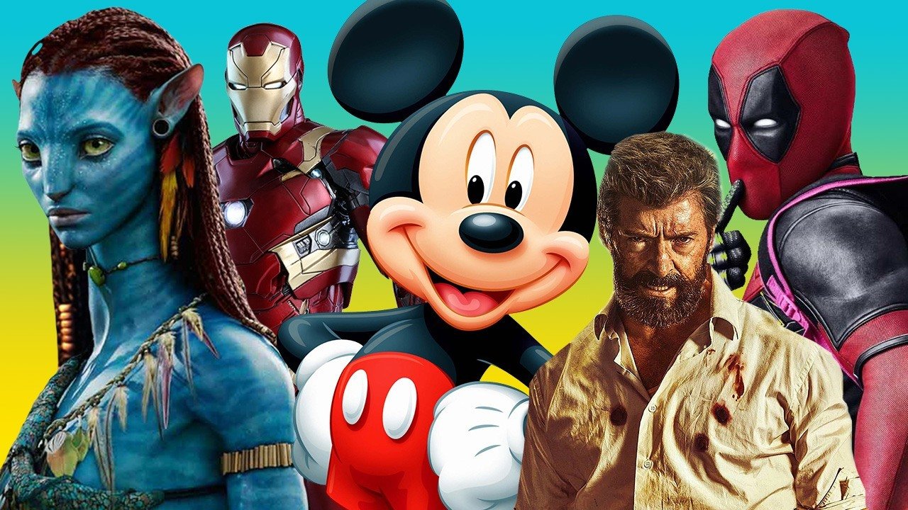 Mickey Mouse stands surrounded by characters the Disney Corp. now owns, such as Iron Man, Deadpool, Wolverine, and one of the blue cat people from Avatar.