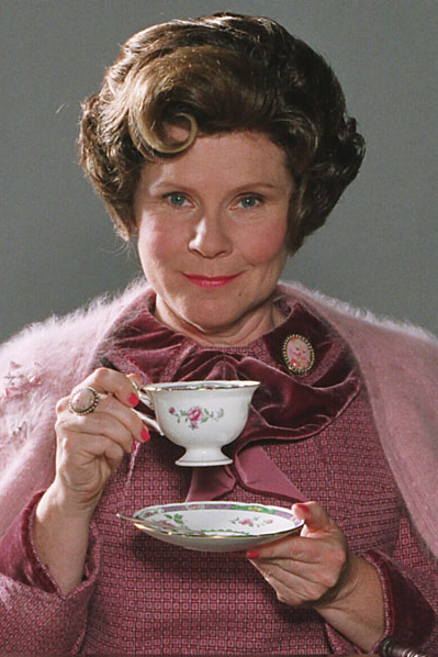 The seemingly sweet Dolores Umbridge sips tea while dressed in pink