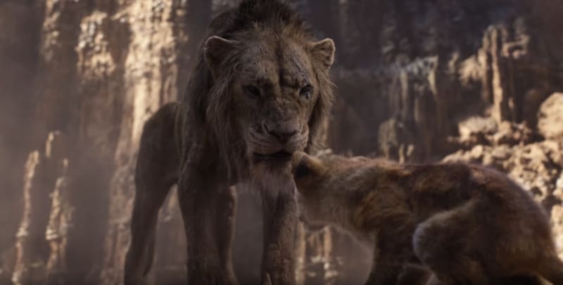 The menacing Scar, a scraggily lion towers over a hyena against an African rocky backdrop