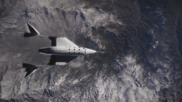 A spaceship flies low over the Earth's atmosphere in the vacuum of space