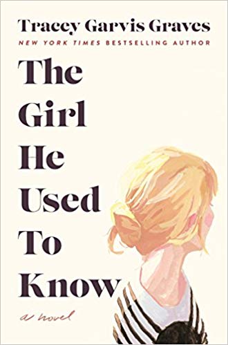 A young woman in blonde hair stands facing away from the viewer