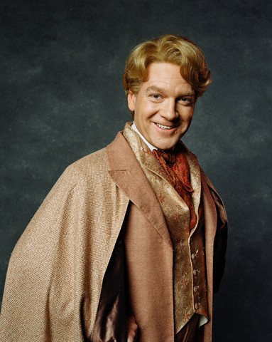 Gildeory Lockhart stands in a golden uniform against a dark backdrop
