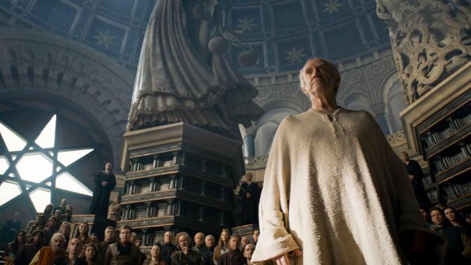 The High Sparrow stands tall before the huddle masses inside a castle