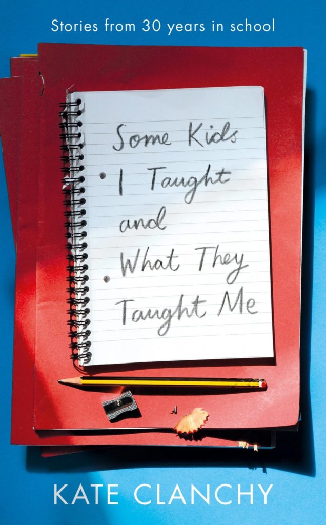 A notebook sitting on some schoolbooks with a pencil 