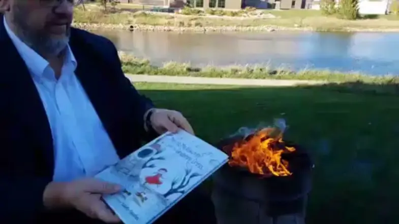 Anti-LGBTQ Book-Burner Punished With…$65 Fine