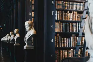 History books on dark bookshelves in library