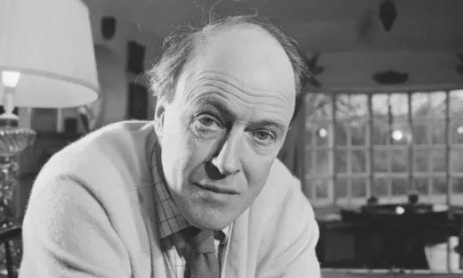 Roald Dahl sitting in black and white photo