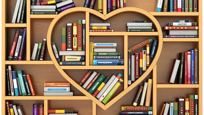 Books on a heart-shaped library shelf