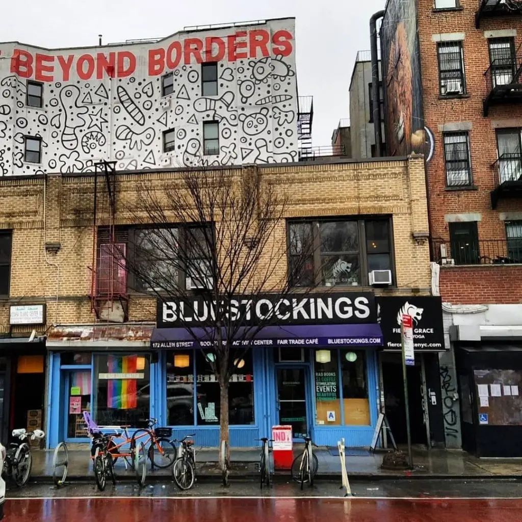 outside Bluestockings with mural