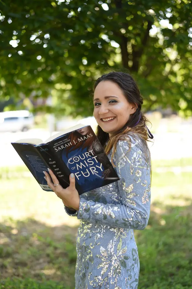 Image of a women holding a book